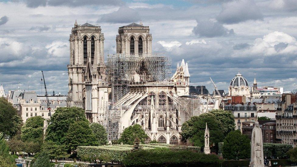 A general view of the East face of Notre-Dame Cathedral and the Seine river in Paris