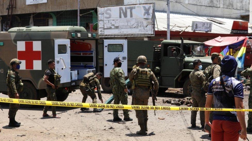 Filipino soldiers are pictured on the site of an explosion in Jolo Island, Sulu province, Philippines