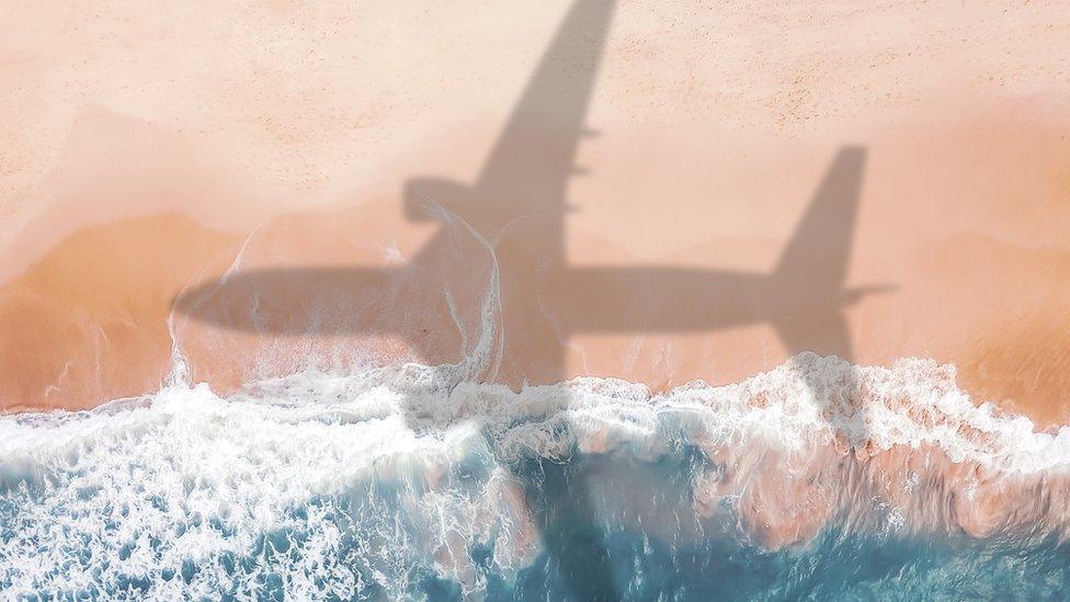Plane shadow on beach