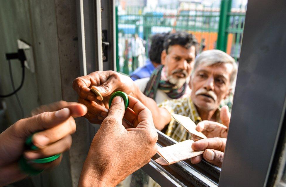 Customers buying tokens for breakfast at the canteen