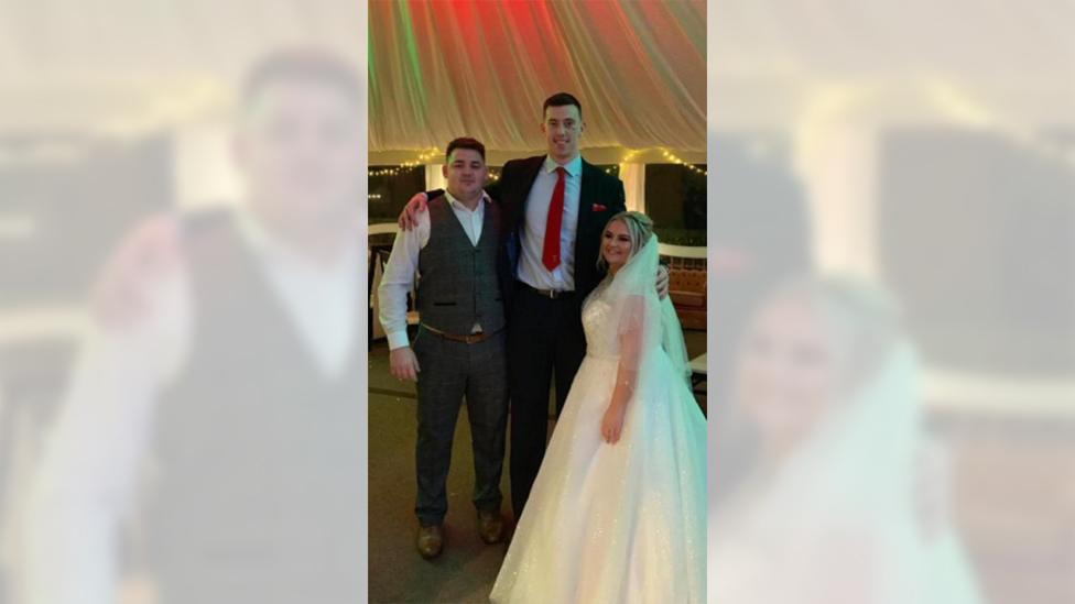 Adam Beard with bride and groom