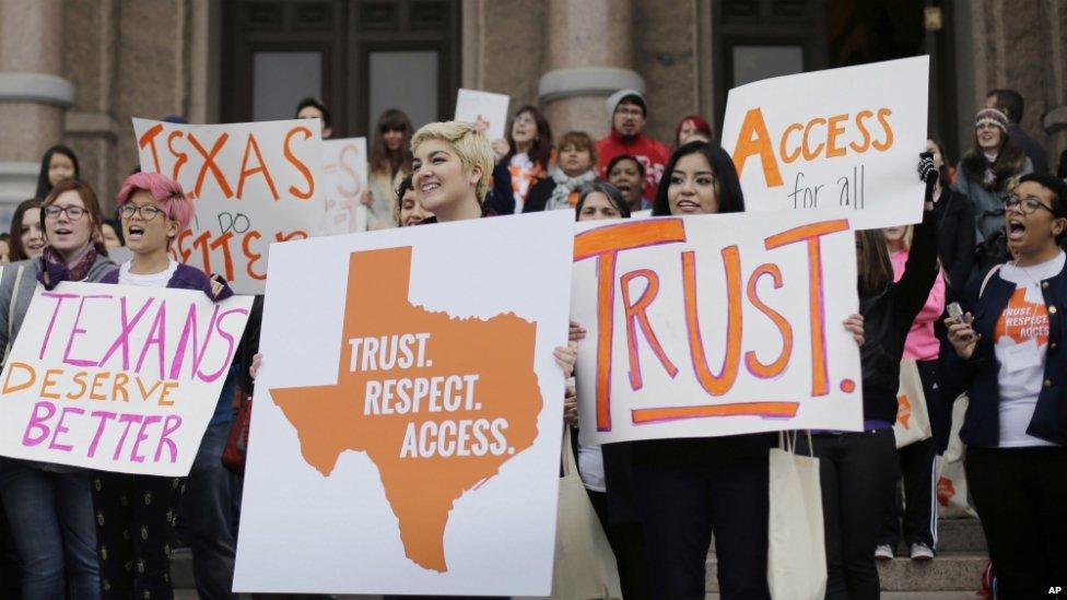 College students and abortion rights activists hold signs during a rally on the steps of the Texas Capitol, in Austin, Texas - 26 February 2015