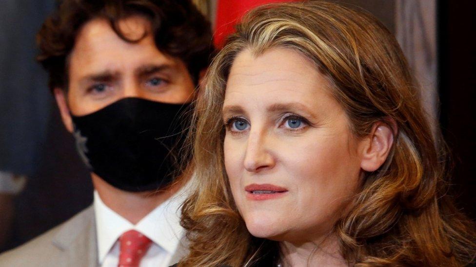 Finance Minister Chrystia Freeland speaks to reporters next to Prime Minister Justin Trudeau in Ottawa,