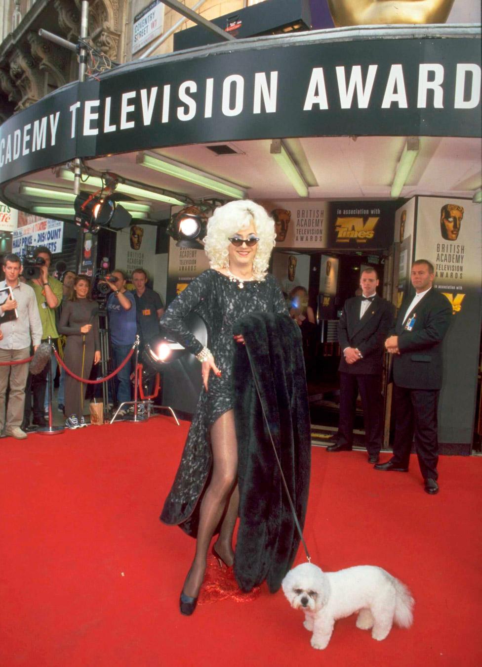 Comedian and television presenter Paul O'Grady (dressed as his alter ego Lily Savage), arriving at the BAFTA TV Awards, circa 1998