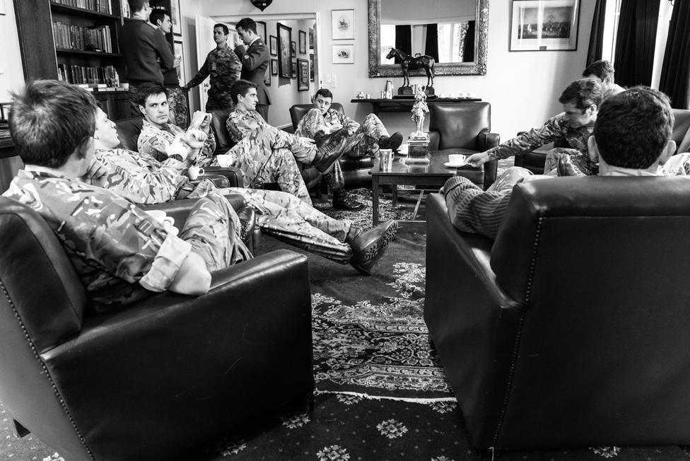 Officers of The Queen's Royal Hussars officers’ mess meet for coffee after lunch at Athlone Barracks. Sennelager, 2018