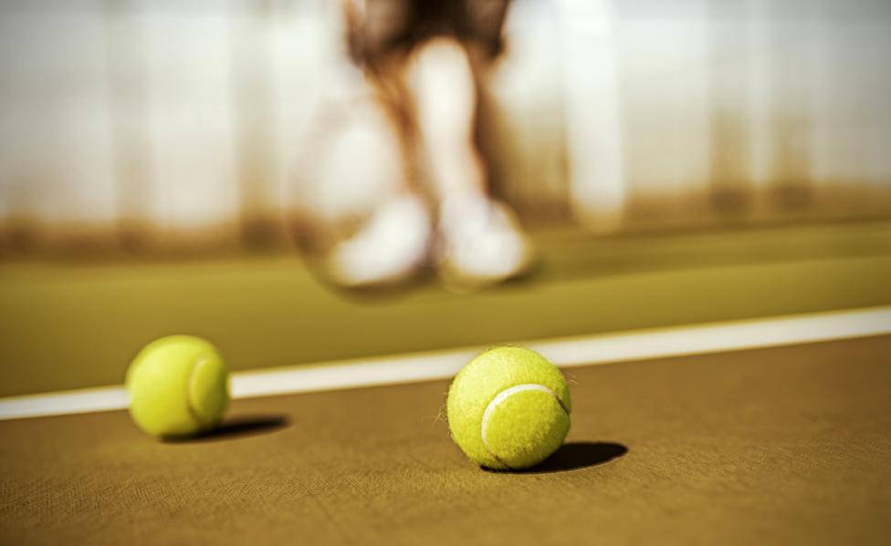 Tennis balls on court