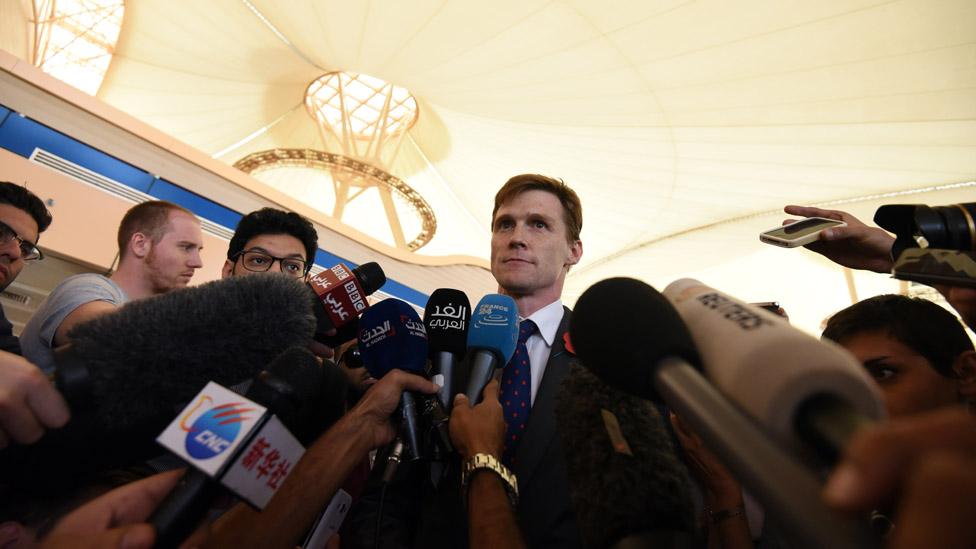 John Casson surrounded by journalists at Sharm el-Sheikh airport - November 2015