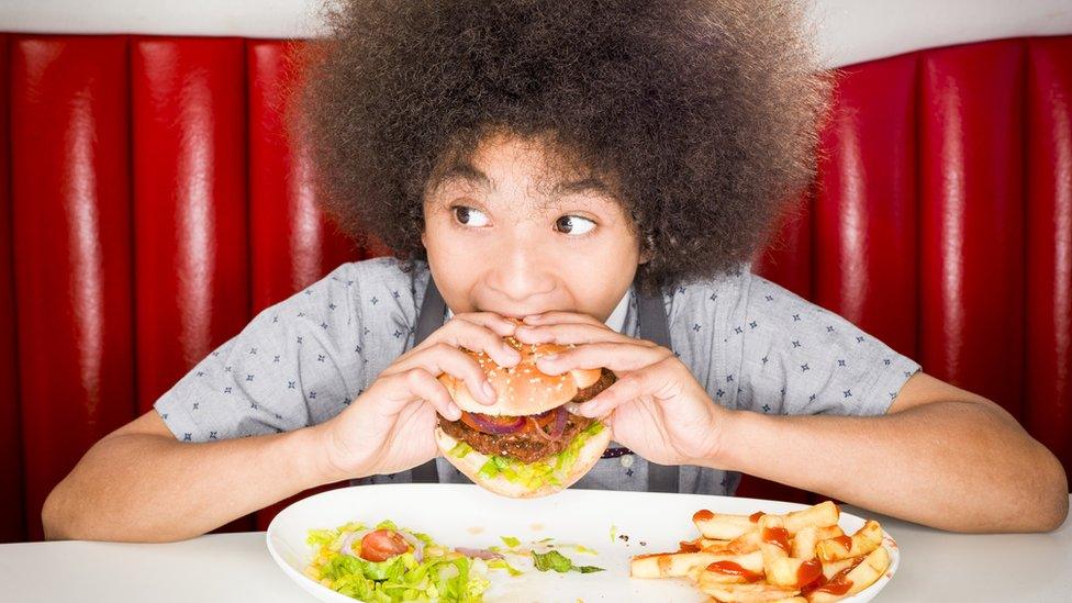 Child eating a burger