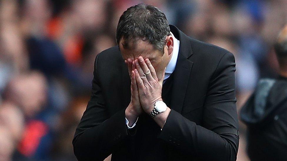 Paul Clement holds his head in his hands