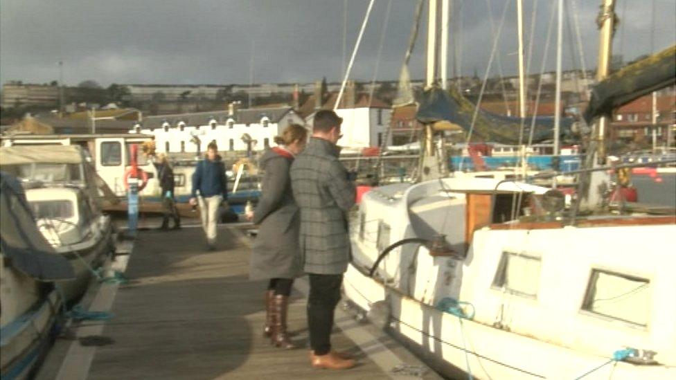 People looking at the boats