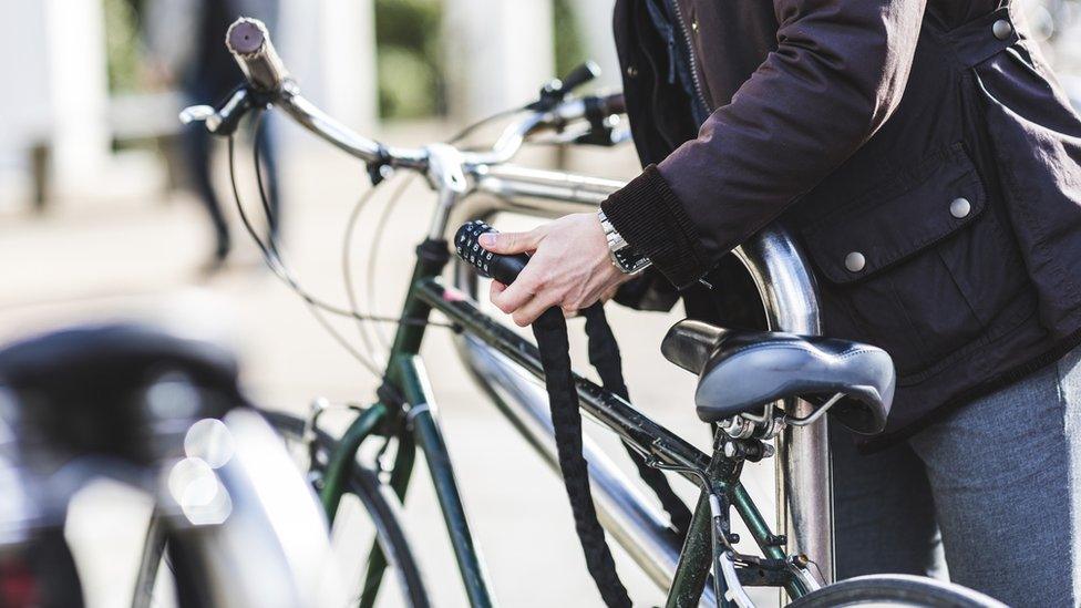 Person locking bike