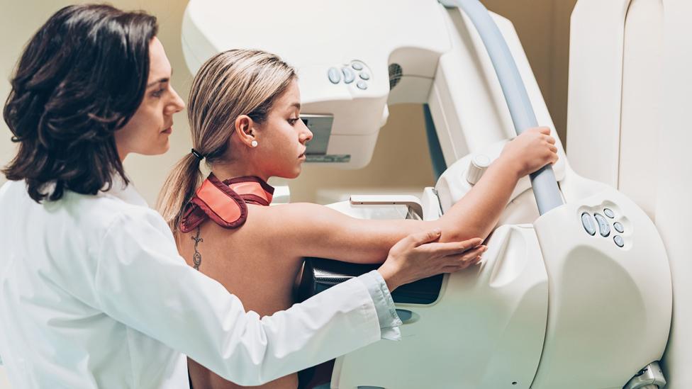 A doctor and patient at a breast screening