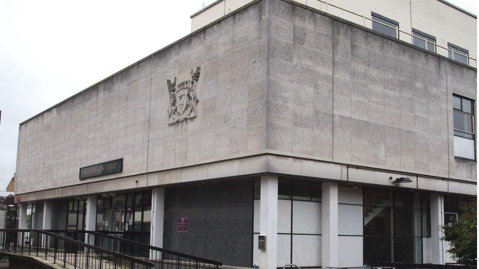 St Albans Crown Court is a large, rectangular grey building.