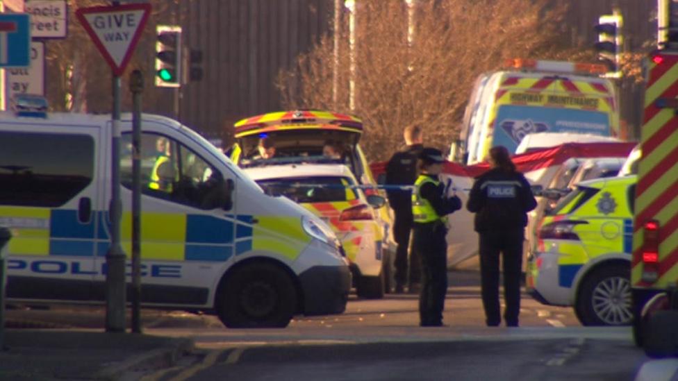 Police vehicles at scene