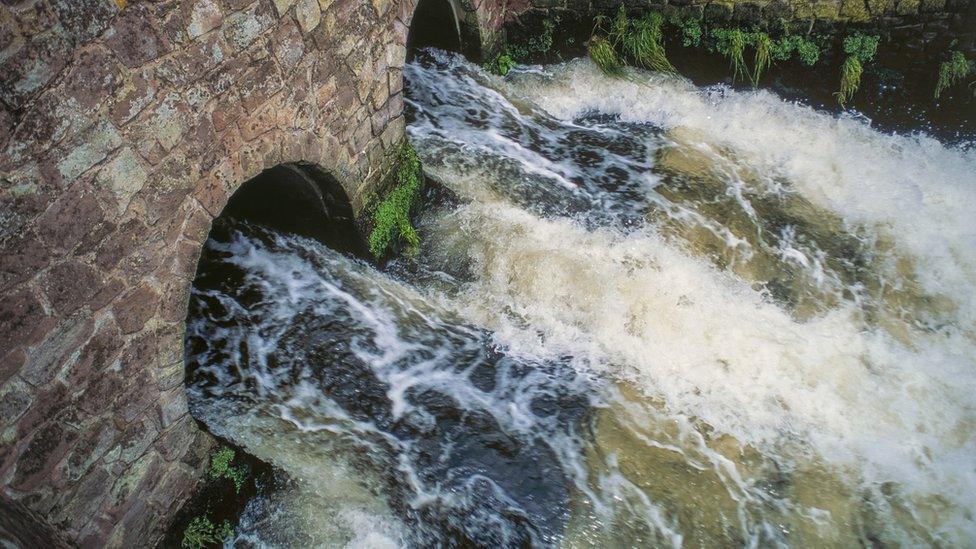 sewage-going-into-river.