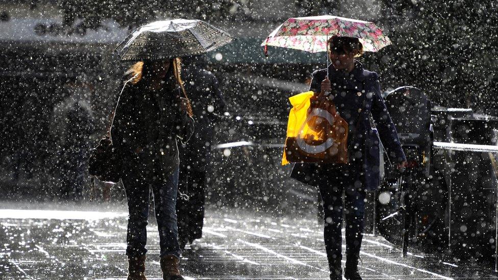 People walking in heavy rain in Stockholm