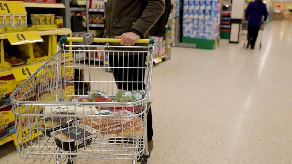 A man shopping in a supermarket