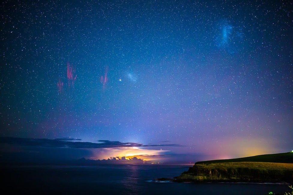 A panoramic image showing sprites and the Aurora Australis