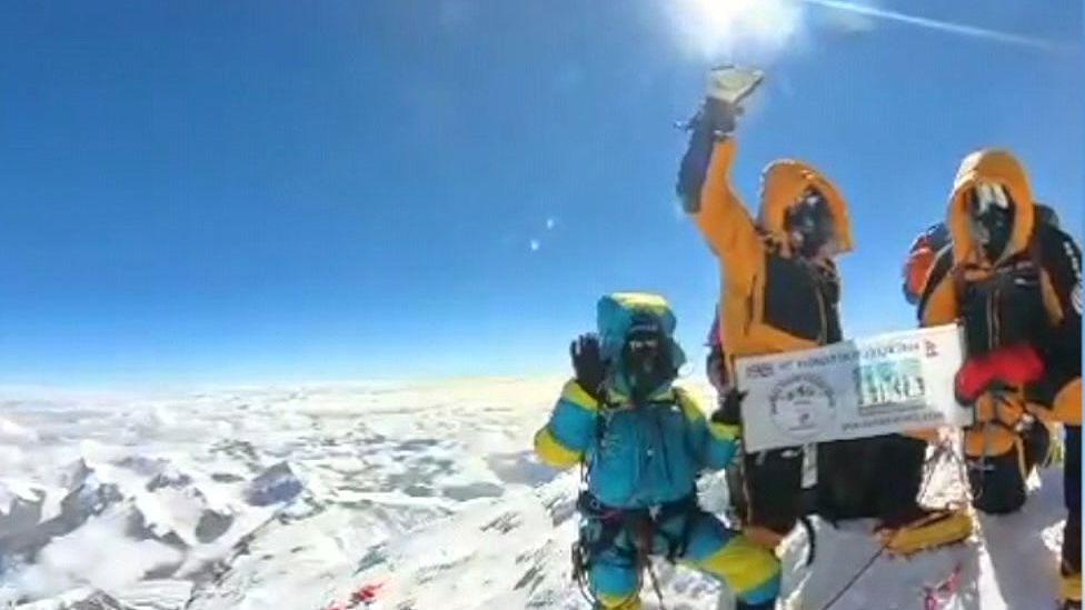 Paul and Aaron Anderson (centre and far right) at Mount Everest summit