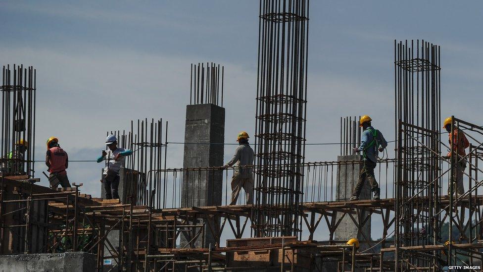 Construction workers in Kuala Lumpur: Malaysia's economy is likely to feel the fallout from this week's events