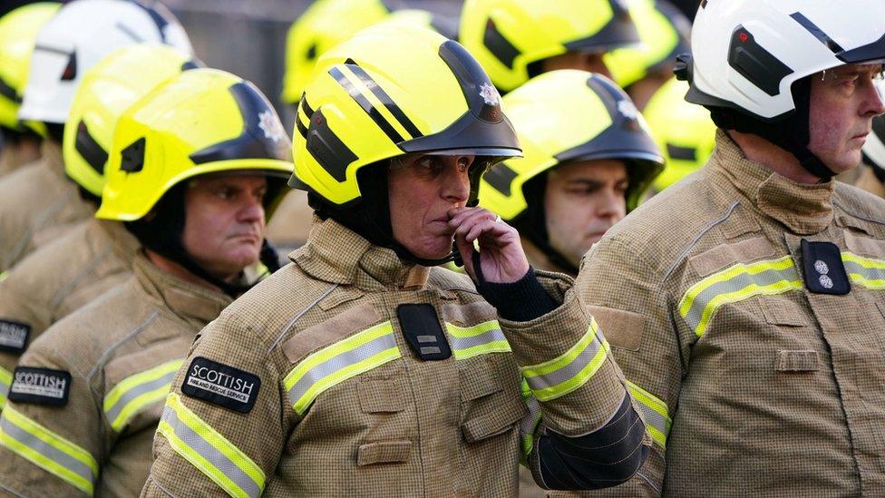 firefighters outside the cathedral