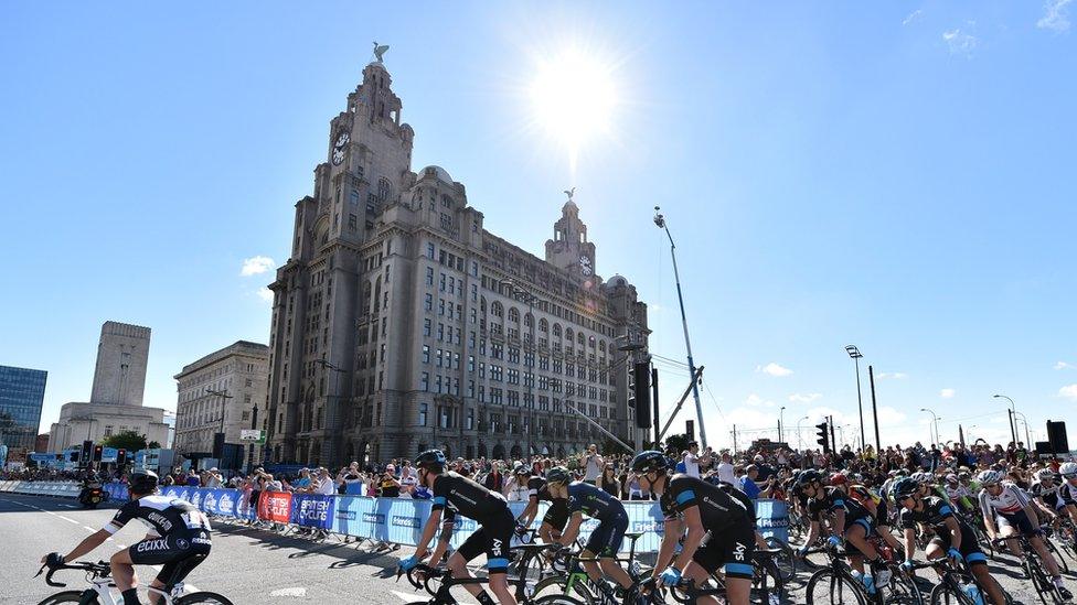 The riders start the race in front of the Royal Liver Building, on the streets of Liverpool during the 104.8 km first stage of the Tour of Britain cycle race on September 7, 2014