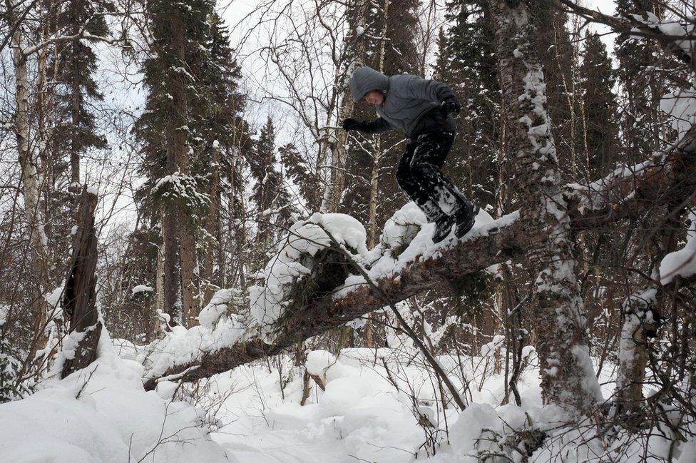 Sky jumps off a log