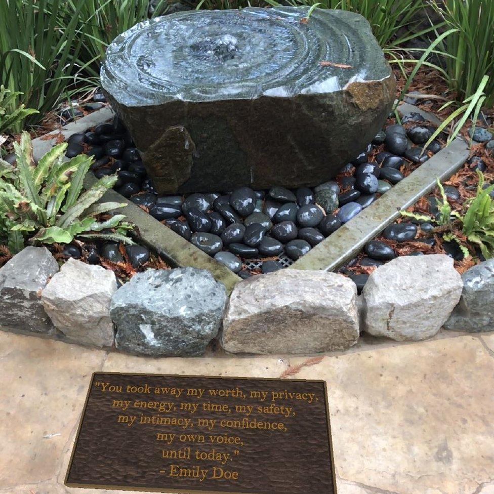 The garden at Stanford University with an augmented reality plaque bearing the words of Chanel Miller