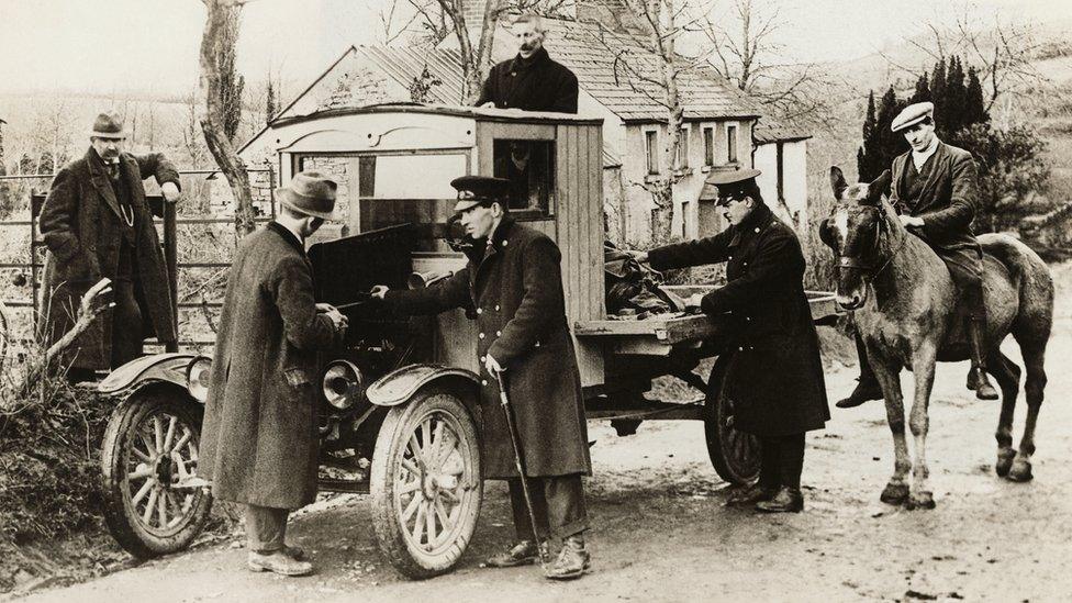 A truck returning from Northern Ireland is stopped at the border by Irish Free State customs officers (1925)