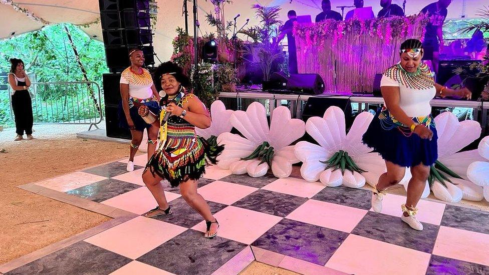 A trio of dancers on stage at Afrofest