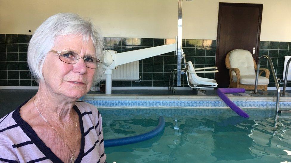 Anne Kavanagh in front of pool equipment