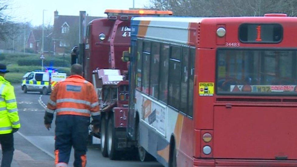 The bus being removed fro the scene