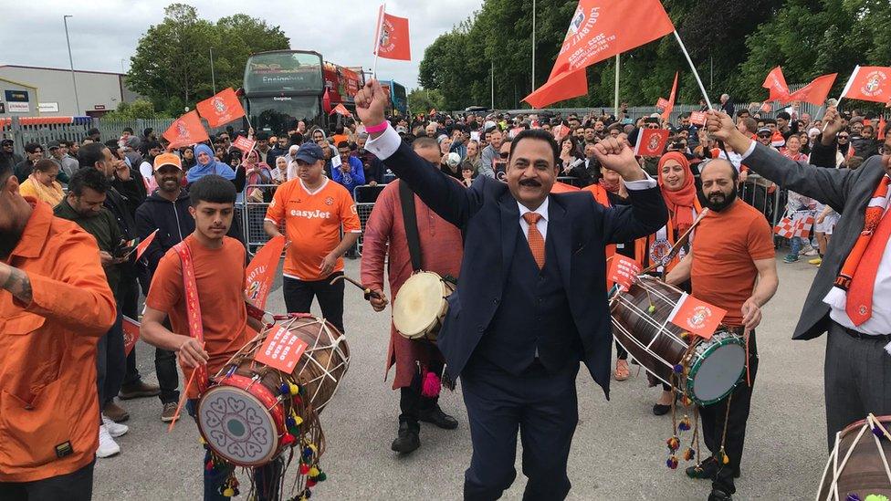 Aslam Khan dancing with Dhols Royce drummers in Luton