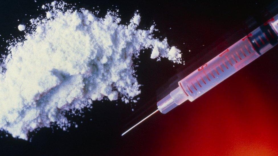 Syringe and heroin powder - generic