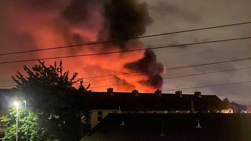 Fire above houses