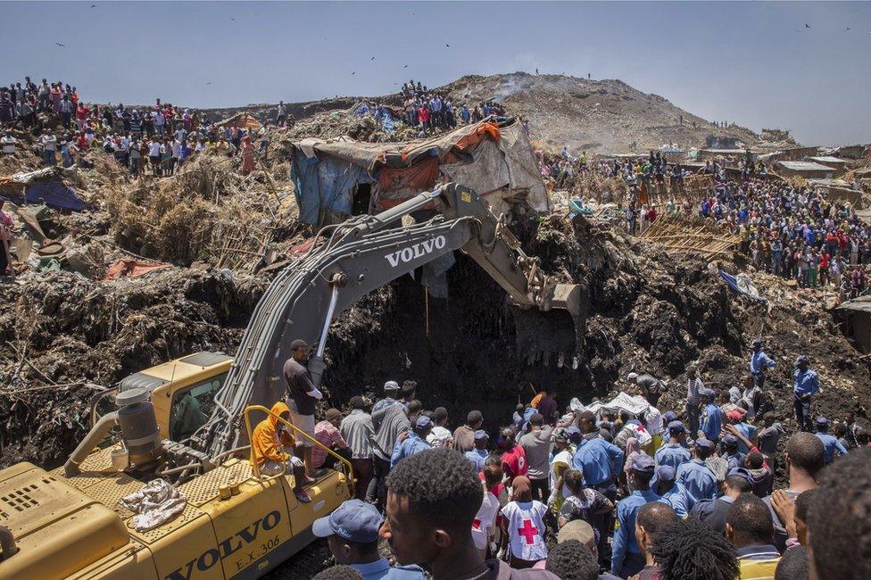 Rescuers work at the scene of a garbage landslide, on the outskirts of the capital Addis Ababa