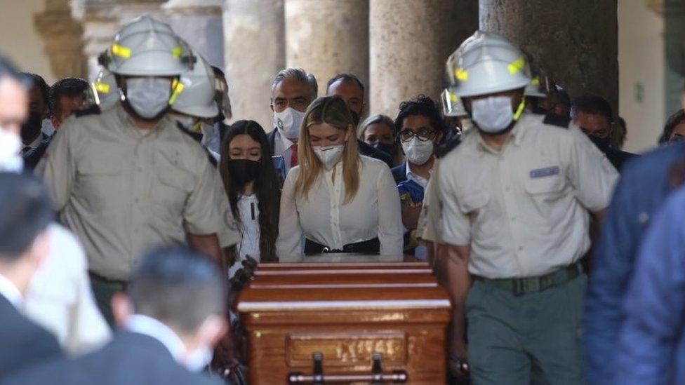 Lorena Jassibe Arriaga (C) accompanies the coffin of her husband, the former Governor of Jalisco Aristoteles Sandoval, during its arrival at the Congress of said state for a posthumous tribute, in Guadalajara, Mexico, 19 December 2020.