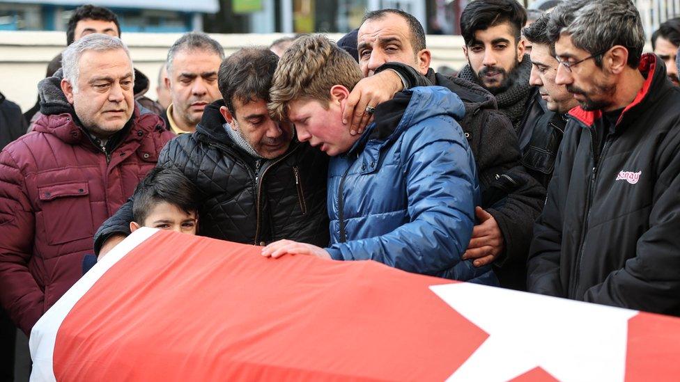 Relatives and friends mourn at a coffin during the funeral of Ayhan Arik, one of the 39 victims of the gun attack on the Reina, a popular night club in Istanbul near by the Bosphorus shores, in Istanbul, January 1, 2017, Turkey.