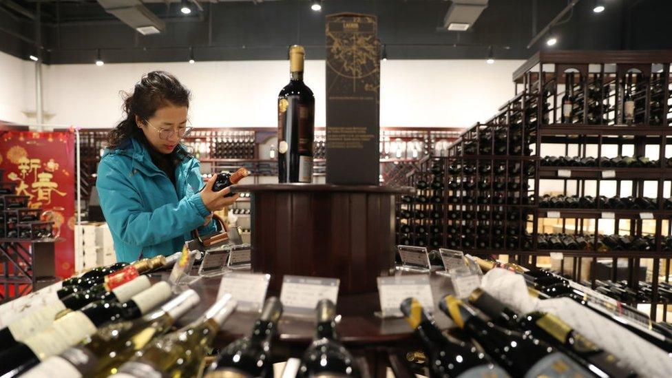 A woman in a wine store in China