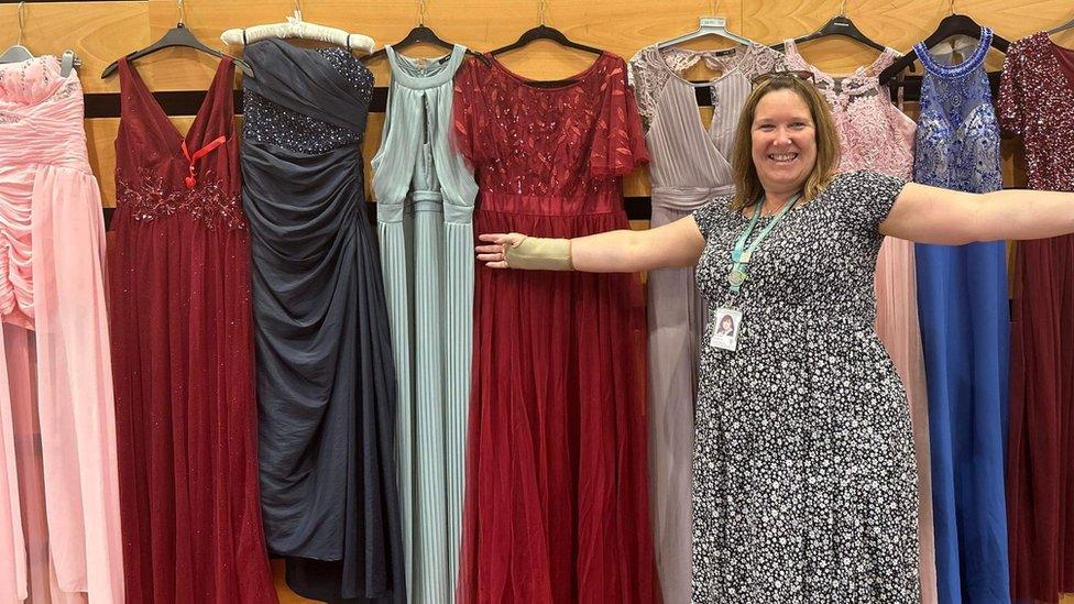 Nicki Burgess with donated prom dresses