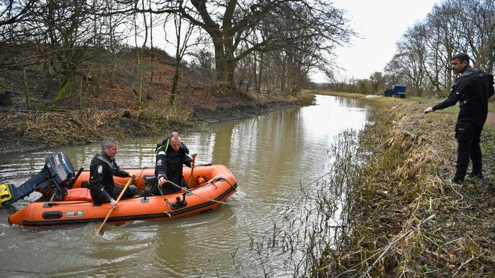 Divers on the water