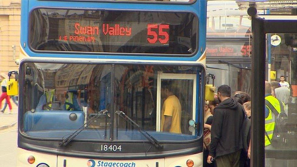 Stagecoach bus with passengers queuing to get aboard