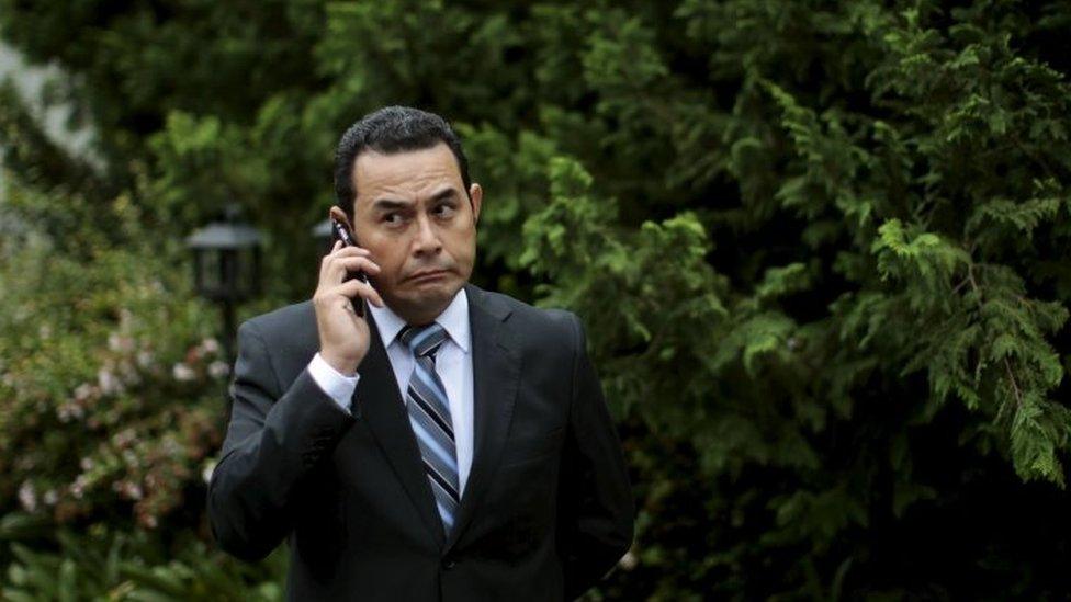 Guatemala's President-elect Jimmy Morales attends to a phone call after a news conference in Guatemala City on 26 October, 2015.