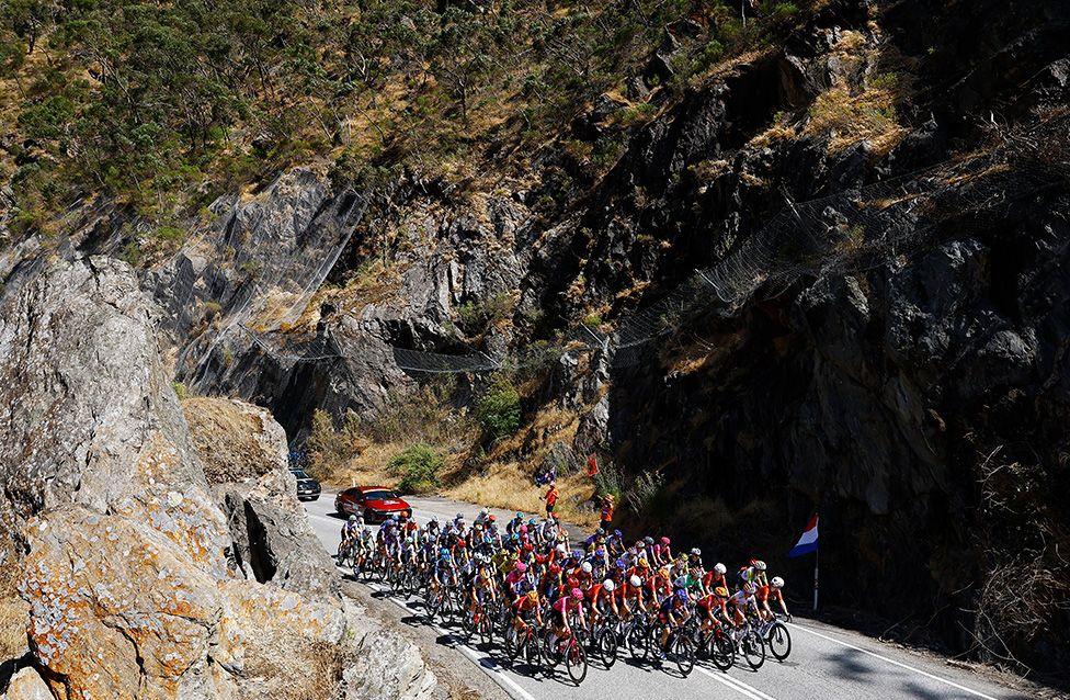 A dramatic view of the peloton on a mountain road during the 10th Women's Tour Down Under in Campbelltown, Australia. Photo by Con Chronis