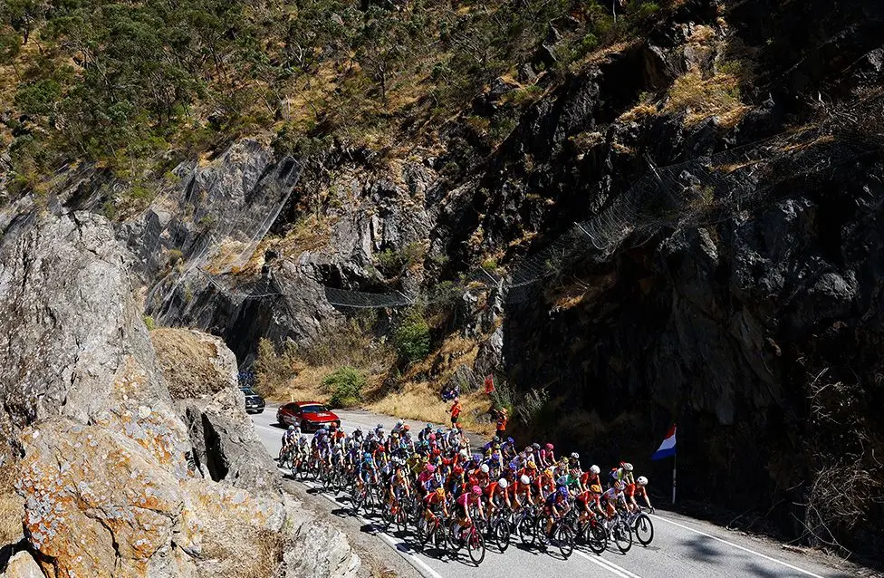 A dramatic view of the peloton on a mountain road during the 10th Women's Tour Down Under in Campbelltown, Australia. Photo by Con Chronis