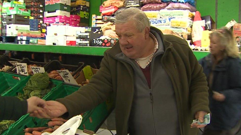 Emyr Owen selling fruit and veg in Bangor market, March 2019