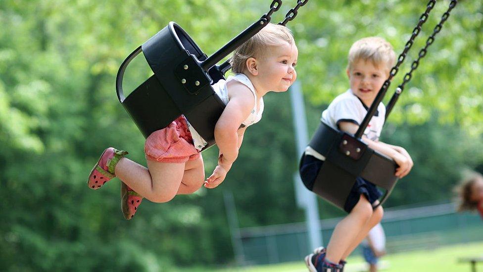 Toddler in a swing