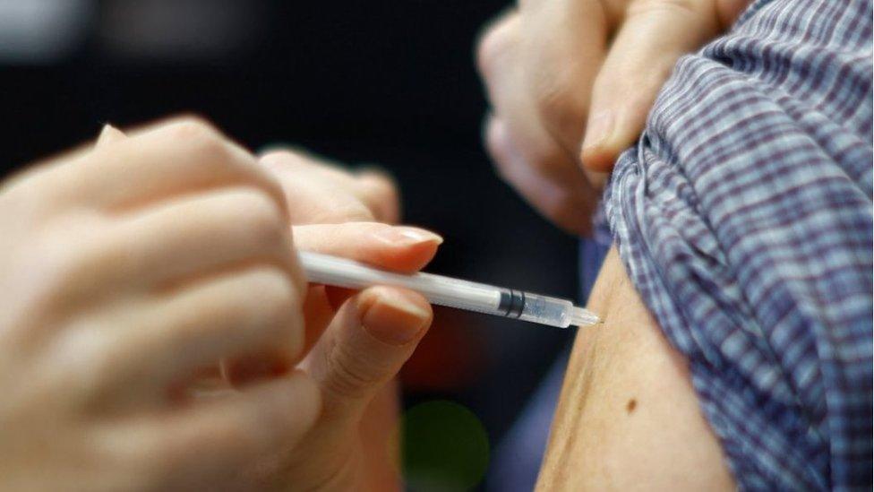 A man receives a Covid-19 vaccine