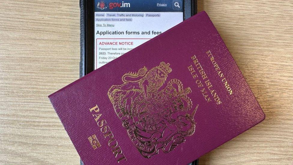 Phone showing passport webpage and old passport