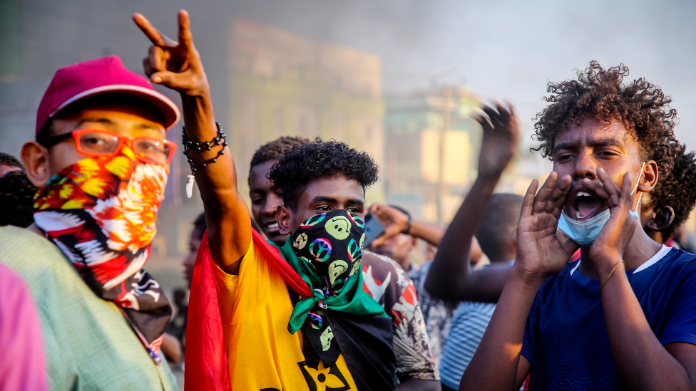 Sudanese protesters chant near by burning tires during a demonstration in the capital Khartoum, Sudan - Tuesday 26 October 2021